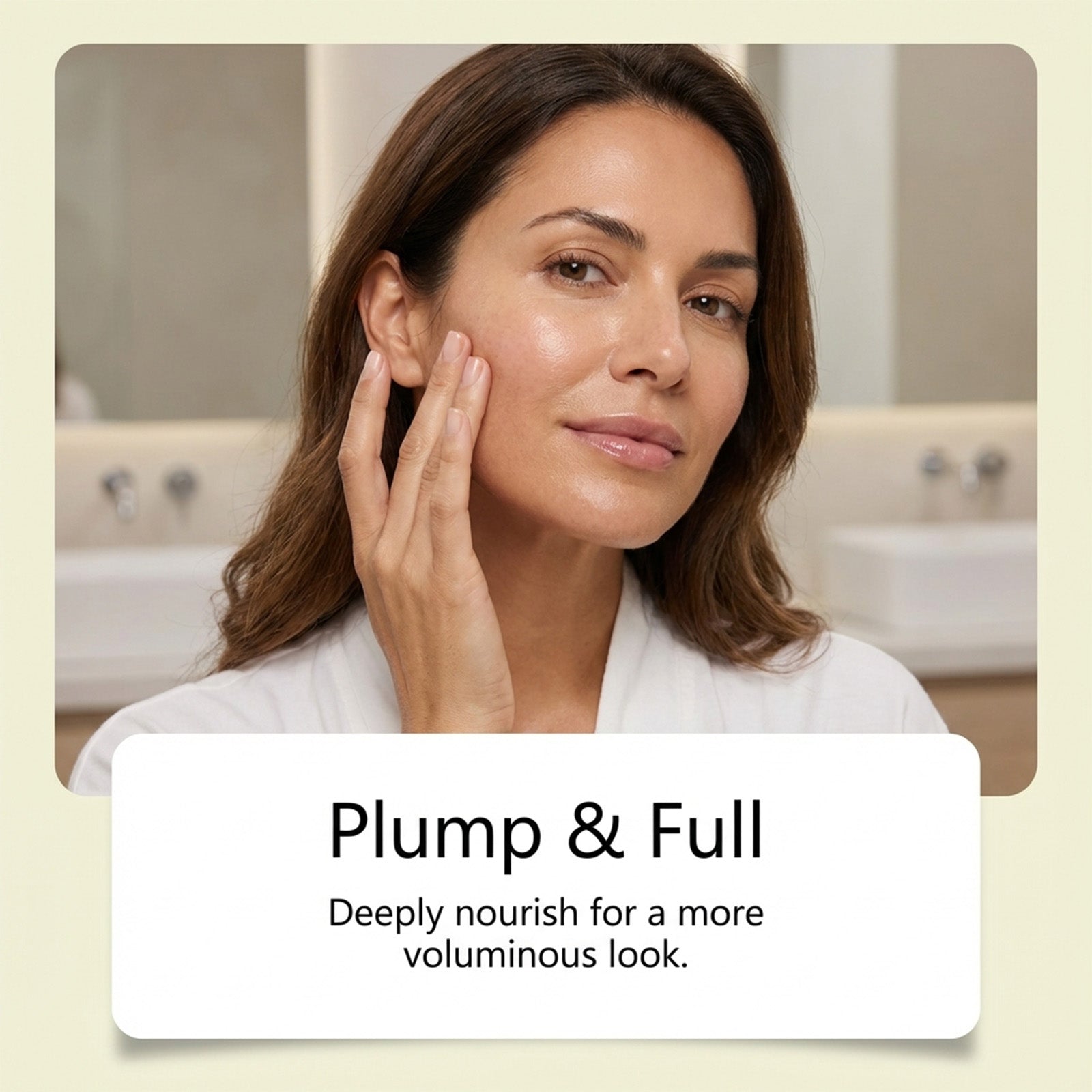Woman applying facial serum to cheek with hand, skincare routine