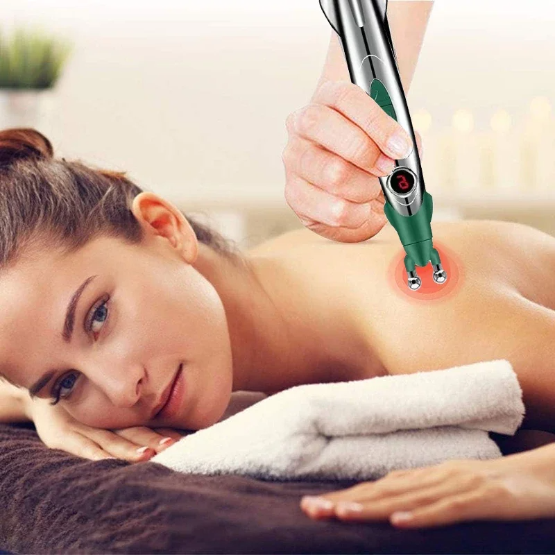 Acupuncture massage pen on neck with green and silver body and glowing tip